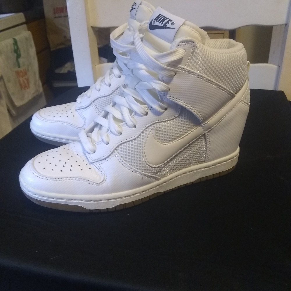 Women's White Nike Dunk Sky High Mesh wedge shoes.